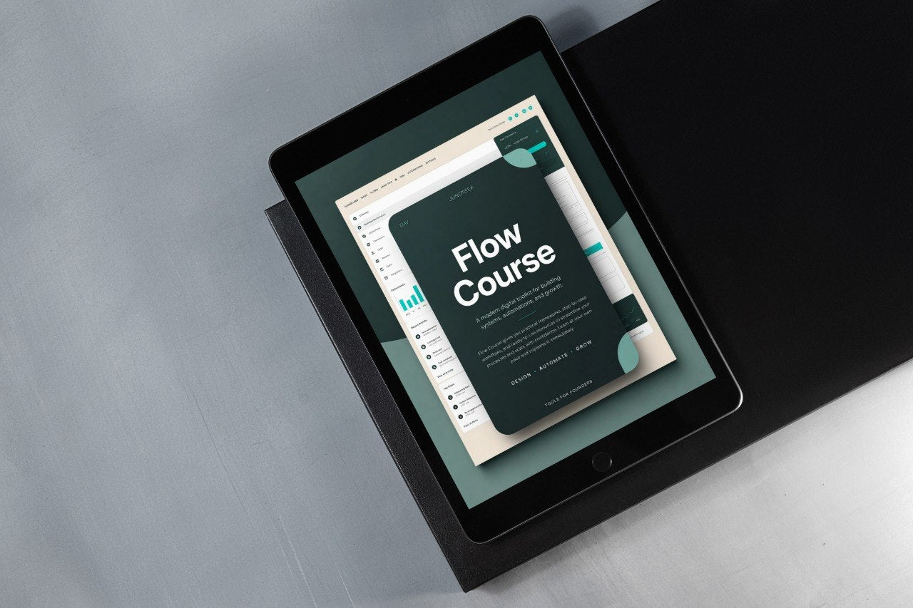 A black tablet device lying on a dark surface, displaying a digital course cover titled 'Flow Course' on its screen against a gray background.