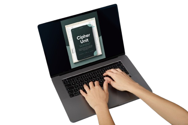 A person's hands typing on a dark gray laptop keyboard, with the screen displaying a digital course or document titled 'Cipher Unit'.
