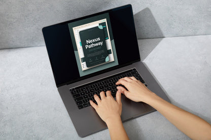A top-down view of a person typing on a dark gray laptop, with the screen displaying a digital course or guide titled 'Nexus Pathway'.